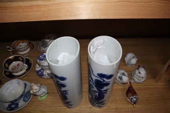 A pair of Chinese blue and white oval section sleeve vases height 25cm (one a.f.)